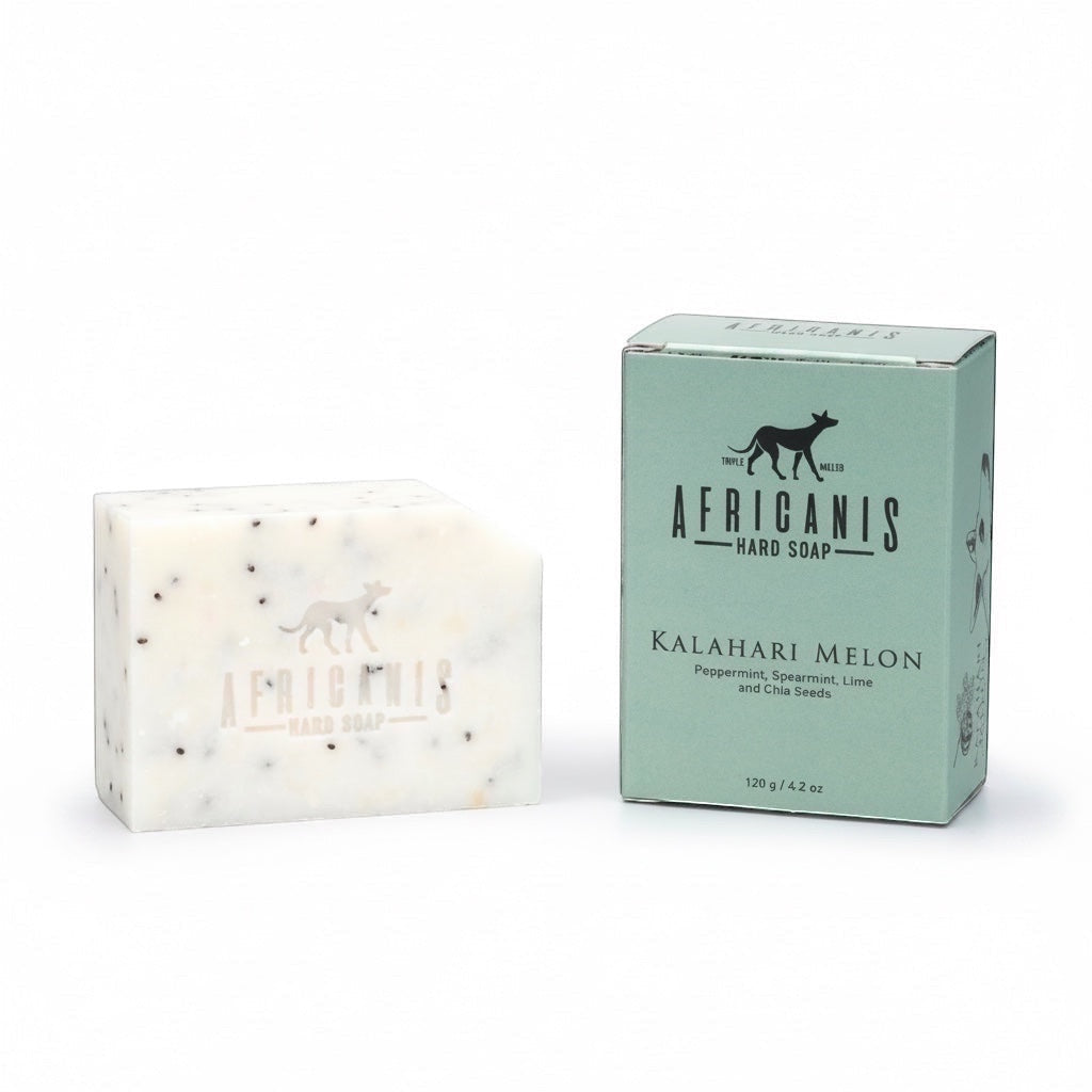 Home-Industry South Africa Africanis Kalahari Melon hard soap bar with chia seeds next to its mint green box.