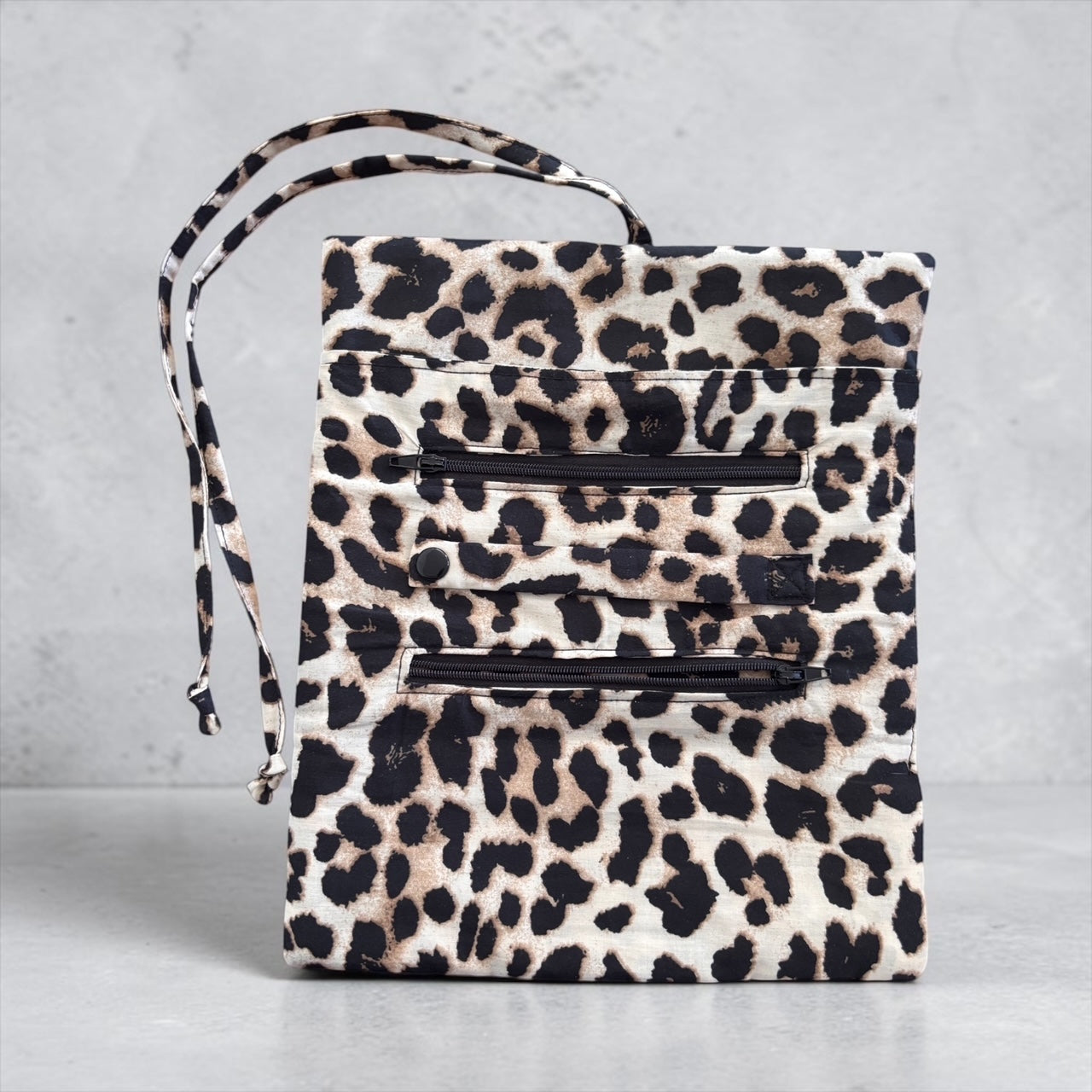 Home-Industry South Africa leopard print fabric jewellery roll with zippered compartments and tie closure