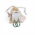 Home-Industry South Africa Willow green beaded teardrop earrings with gold-tone hooks and cotton gift pouch.